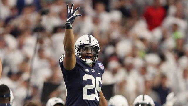 GLENDALE, AZ - DECEMBER 30: Running back Saquon Barkley #26 of the Penn State Nittany Lions celebrates after scoring on a 92 yard touchdown rush against the Washington Huskies during the first half of the Playstation Fiesta Bowl at University of Phoenix Stadium on December 30, 2017 in Glendale, Arizona.