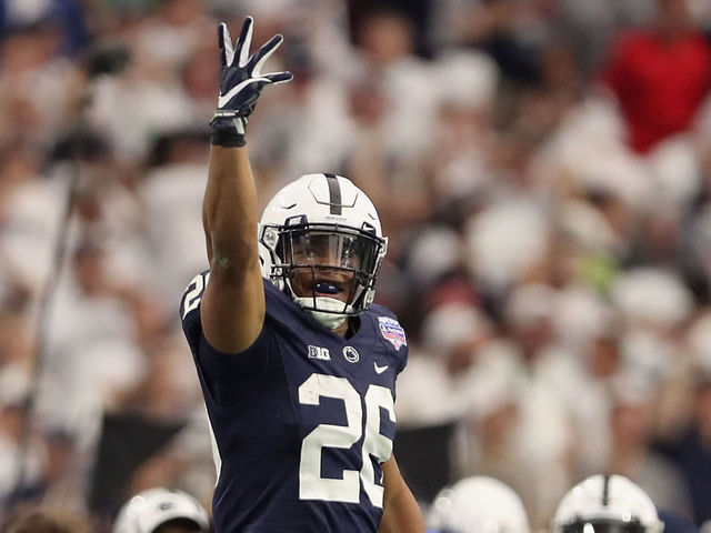 GLENDALE, AZ - DECEMBER 30: Running back Saquon Barkley #26 of the Penn State Nittany Lions celebrates after scoring on a 92 yard touchdown rush against the Washington Huskies during the first half of the Playstation Fiesta Bowl at University of Phoenix Stadium on December 30, 2017 in Glendale, Arizona.