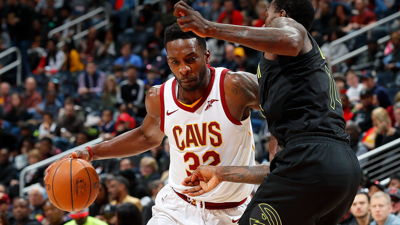 ATLANTA, GA - FEBRUARY 09: Jeff Green #32 of the Cleveland Cavaliers drives against Dewayne Dedmon #14 of the Atlanta Hawks at Philips Arena on February 9, 2018 in Atlanta, Georgia.