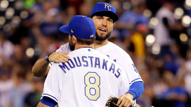 KANSAS CITY, MO - APRIL 14: Eric Hosmer #35 and Mike Moustakas #8 of the Kansas City Royals congratulate each other after the Royals defeated the Los Angeles Angels 7-1 to win the game at Kauffman Stadium on April 14, 2017 in Kansas City, Missouri.