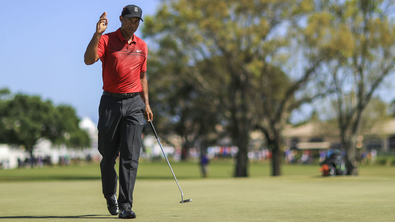 PALM BEACH GARDENS, FL - FEBRUARY 25: Tiger Woods acknowledges the crowd after a putt on the fourth hole during the final round of the Honda Classic at PGA National Resort and Spa on February 25, 2018 in Palm Beach Gardens, Florida.