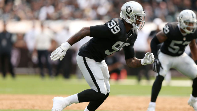 OAKLAND, CA - SEPTEMBER 13: Aldon Smith #99 of the Oakland Raiders rushes against the Cincinnati Bengals during the first half of their NFL game at O.co Coliseum on September 13, 2015 in Oakland, California.