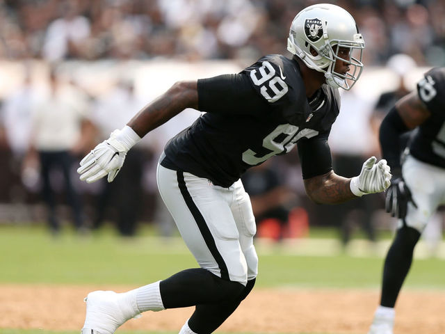 OAKLAND, CA - SEPTEMBER 13: Aldon Smith #99 of the Oakland Raiders rushes against the Cincinnati Bengals during the first half of their NFL game at O.co Coliseum on September 13, 2015 in Oakland, California.