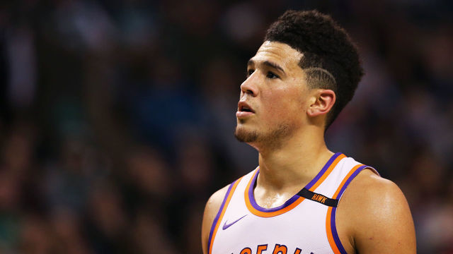 BOSTON, MA - DECEMBER 2: Devin Booker #1 of the Phoenix Suns looks on during the first half at TD Garden on December 2, 2017 in Boston, Massachusetts.