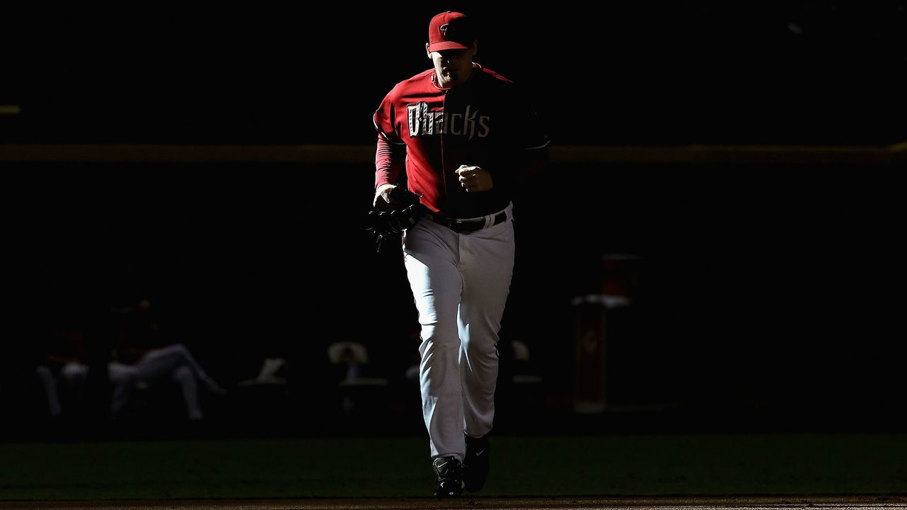 PHOENIX, AZ - SEPTEMBER 21: Relief pitcher J.J. Putz #40 of the Arizona Diamondbacks runs out of the bullpen to pitch against the Pittsburgh Pirates during the ninth inning of the Major League Baseball game at Chase Field on September 21, 2011 in Phoenix, Arizona. The Diamodbacks defeated the Pirates 8-5.