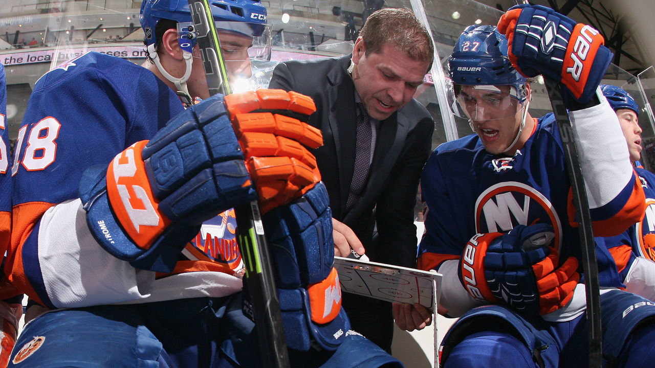 UNIONDALE, NY - DECEMBER 15: Assistant coach Doug Weight speaks with Ryan Strome #18 (L) and Anders Lee #27 (R) of the New York Islanders during the game against the New Jersey Devils at the Nassau Veterans Memorial Coliseum on December 15, 2014 in Uniondale, New York.