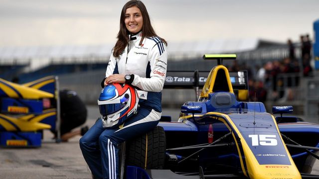 A picture taken on July 13, 2017, shows Tatiana Calderon, Colombian racing driver, posing next to her car at the Silverstone motor racing circuit, ahead of the British Formula One Grand Prix . During the 68 different editions of the World Formula 1 Championship, only two women took the start of a Grand Prix, it was on 1976. Even if in theory women have access to all categories of motor racing, the International Automobile Federation (FIA) can not ignore that women are significantly fewer in the fields, and this starting from an early age. / AFP PHOTO / ANDREJ ISAKOVIC
