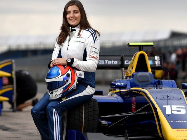 A picture taken on July 13, 2017, shows Tatiana Calderon, Colombian racing driver, posing next to her car at the Silverstone motor racing circuit, ahead of the British Formula One Grand Prix . During the 68 different editions of the World Formula 1 Championship, only two women took the start of a Grand Prix, it was on 1976. Even if in theory women have access to all categories of motor racing, the International Automobile Federation (FIA) can not ignore that women are significantly fewer in the fields, and this starting from an early age. / AFP PHOTO / ANDREJ ISAKOVIC