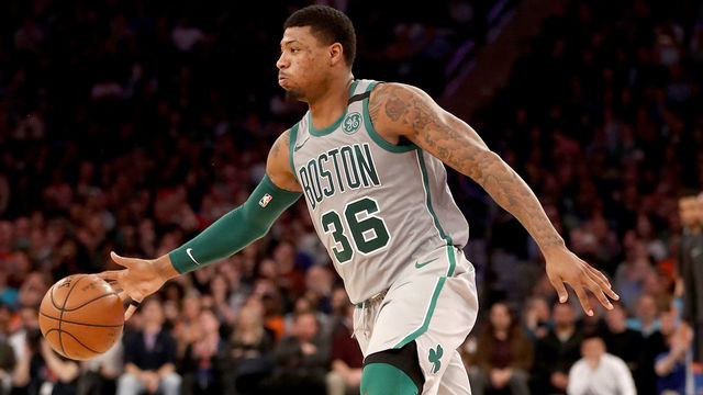 NEW YORK, NY - FEBRUARY 24: Marcus Smart #36 of the Boston Celtics takes the ball in the second half against the New York Knicks at Madison Square Garden on February 24,2018 in New York City.