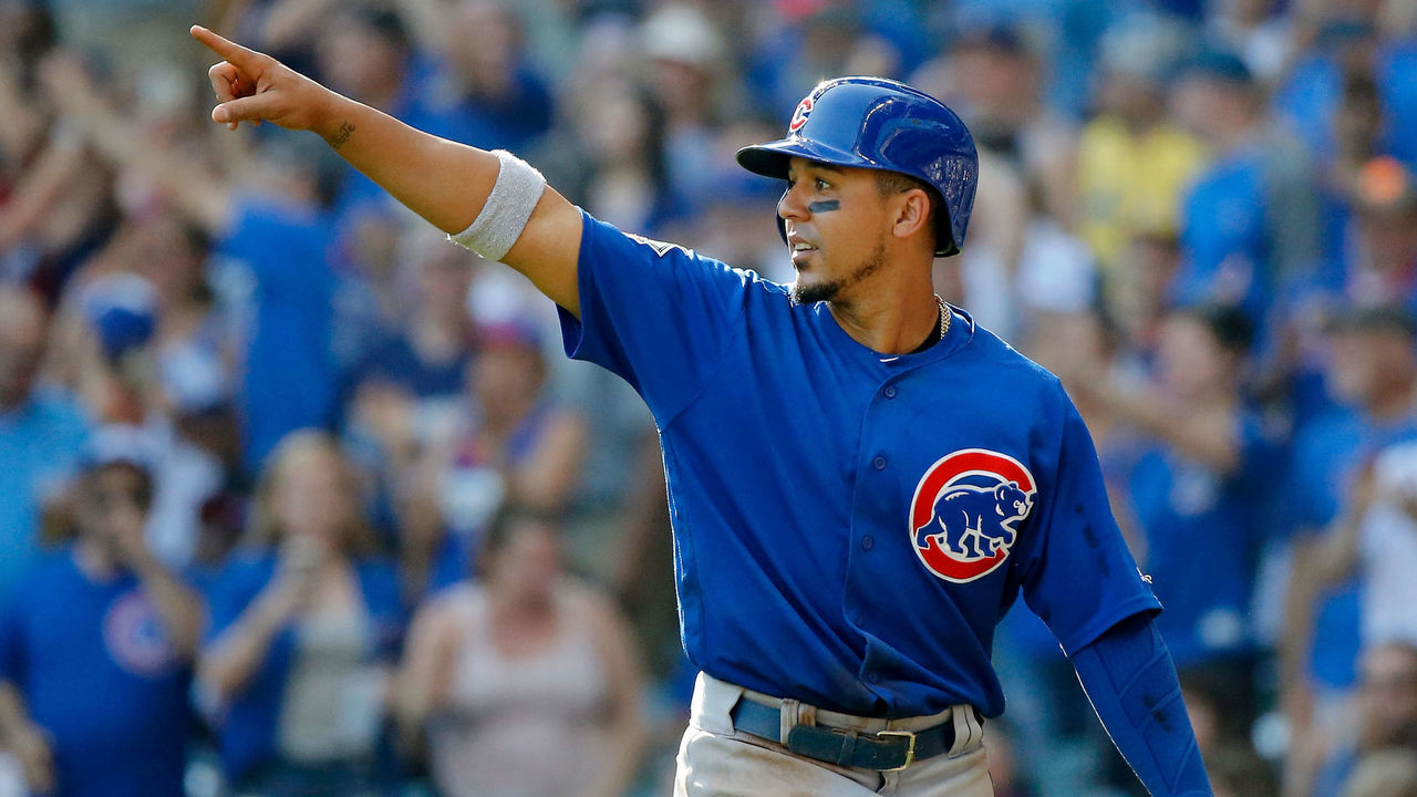 MILWAUKEE, WI - SEPTEMBER 24: Jon Jay #30 of the Chicago Cubs points to Anthony Rizzo #44 after scoring on his two run RBI double against the Milwaukee Brewers during the eighth inning at Miller Park on September 24, 2017 in Milwaukee, Wisconsin.