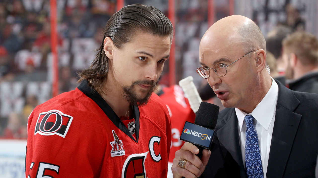 OTTAWA, ON - MAY 19: Erik Karlsson #65 of the Ottawa Senators talks with commentator Pierre McGuire prior to Game Four of the Eastern Conference Final against the Pittsburgh Penguins during the 2017 NHL Stanley Cup Playoffs at Canadian Tire Centre on May 19, 2017 in Ottawa, Canada.