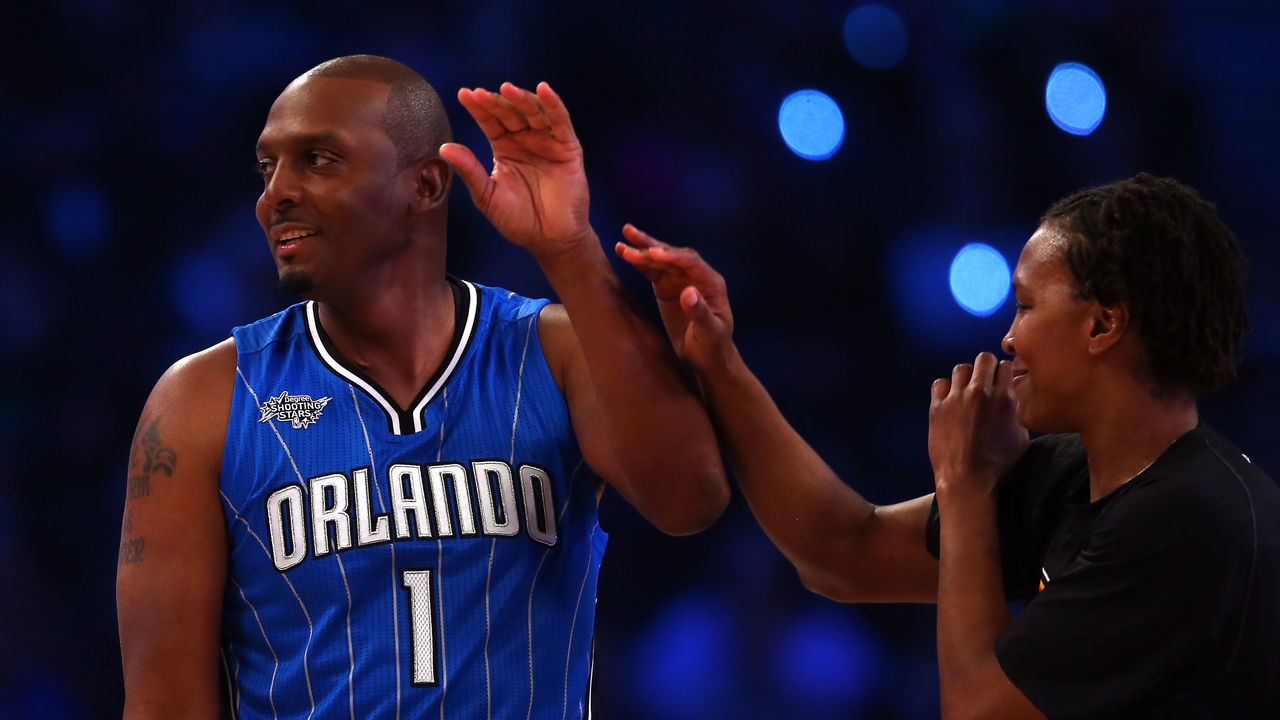 NEW YORK, NY - FEBRUARY 14: NBA Legend Anfernee 'Penny' Hardaway high fives Tamika Catchings of the Indiana Fever during the Degree Shooting Stars Competition as part of the 2015 NBA Allstar Weekend at Barclays Center on February 14, 2015 in the Brooklyn borough of New York City.