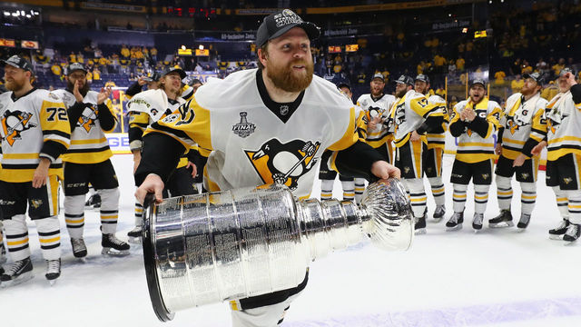 NASHVILLE, TN - JUNE 11: Phil Kessel #81 of the Pittsburgh Penguins celebrates with the Stanley Cup following a victory over the Nashville Predators in Game Six of the 2017 NHL Stanley Cup Final at the Bridgestone Arena on June 11, 2017 in Nashville, Tennessee.