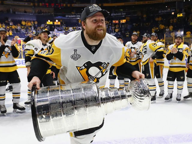 NASHVILLE, TN - JUNE 11: Phil Kessel #81 of the Pittsburgh Penguins celebrates with the Stanley Cup following a victory over the Nashville Predators in Game Six of the 2017 NHL Stanley Cup Final at the Bridgestone Arena on June 11, 2017 in Nashville, Tennessee.
