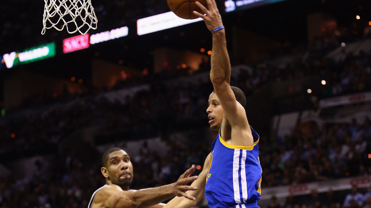 SAN ANTONIO, TX - MAY 06: Stephen Curry #30 of the Golden State Warriors passes the ball against Tim Duncan #21 of the San Antonio Spurs during Game One of the Western Conference Semifinals of the 2013 NBA Playoffs at AT&T Center on May 6, 2013 in San Antonio, Texas.
