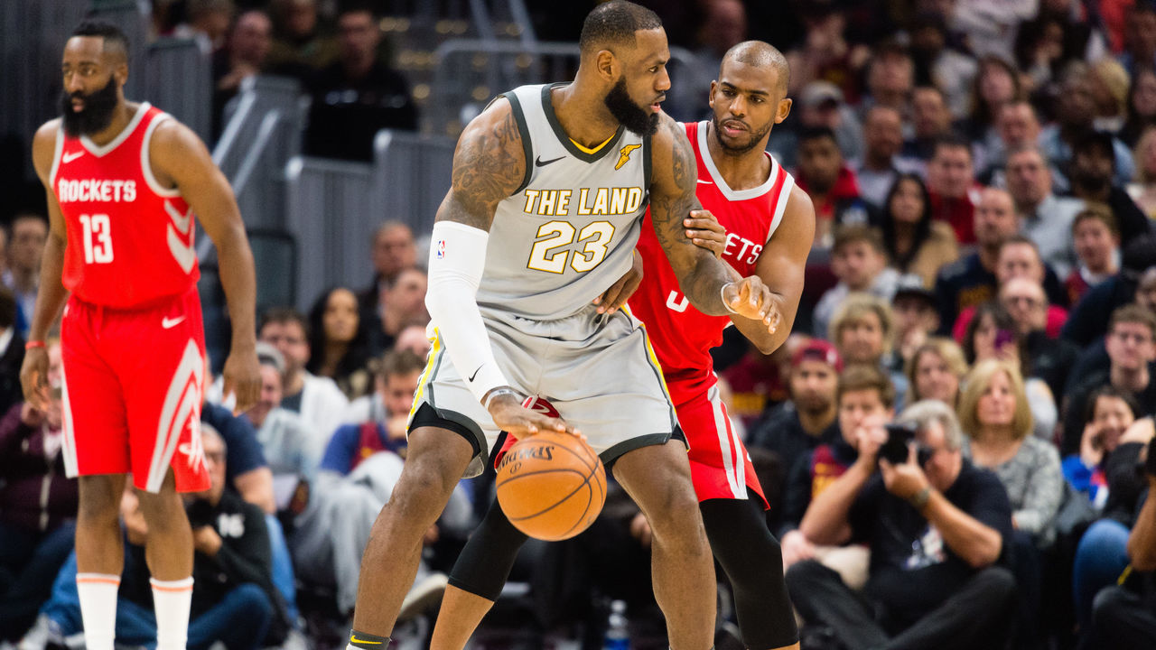 CLEVELAND, OH - FEBRUARY 3: LeBron James #23 of the Cleveland Cavaliers tries to drive around Chris Paul #3 of the Houston Rockets during the first half at Quicken Loans Arena on February 3, 2018 in Cleveland, Ohio.