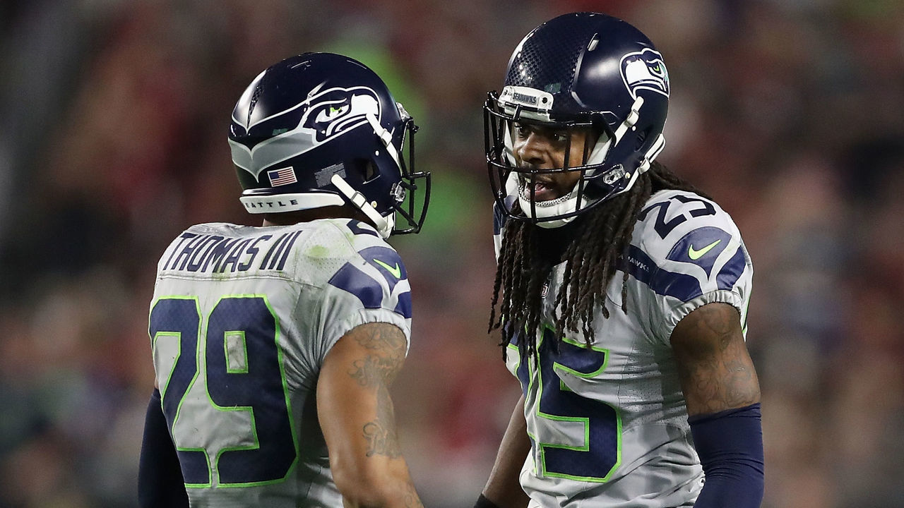 GLENDALE, AZ - OCTOBER 23: Cornerback Richard Sherman #25 (R) of the Seattle Seahawks talks with free safety Earl Thomas #29 during the NFL game against the Arizona Cardinals at the University of Phoenix Stadium on October 23, 2016 in Glendale, Arizona. The Cardinals and Seahawks tied 6-6.