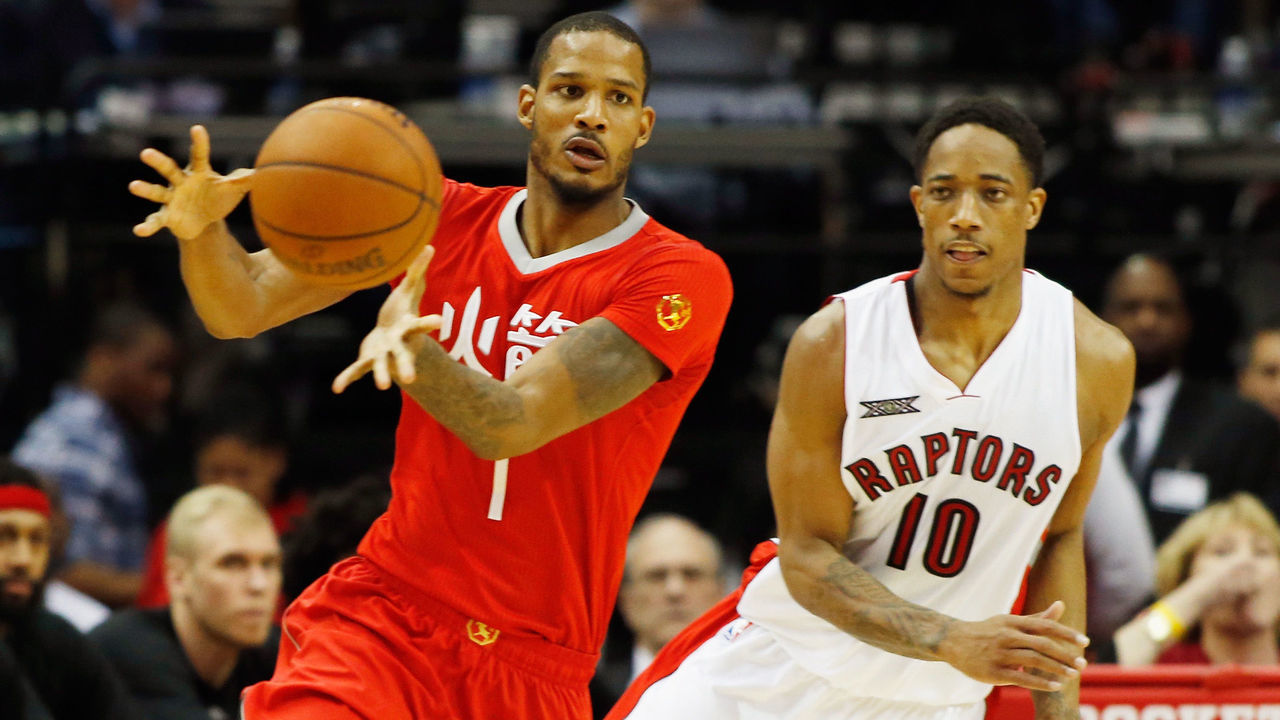 HOUSTON, TX - FEBRUARY 21: DeMar DeRozan #10 of the Toronto Raptors defends against Trevor Ariza #1 of the Houston Rockets during their game at the Toyota Center on February 21, 2015 in Houston, Texas. NOTE TO USER: User expressly acknowledges and agrees that, by downloading and/or using this photograph, user is consenting to the terms and conditions of the Getty Images License Agreement.