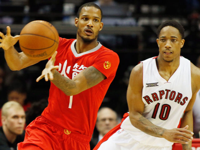 HOUSTON, TX - FEBRUARY 21: DeMar DeRozan #10 of the Toronto Raptors defends against Trevor Ariza #1 of the Houston Rockets during their game at the Toyota Center on February 21, 2015 in Houston, Texas. NOTE TO USER: User expressly acknowledges and agrees that, by downloading and/or using this photograph, user is consenting to the terms and conditions of the Getty Images License Agreement.