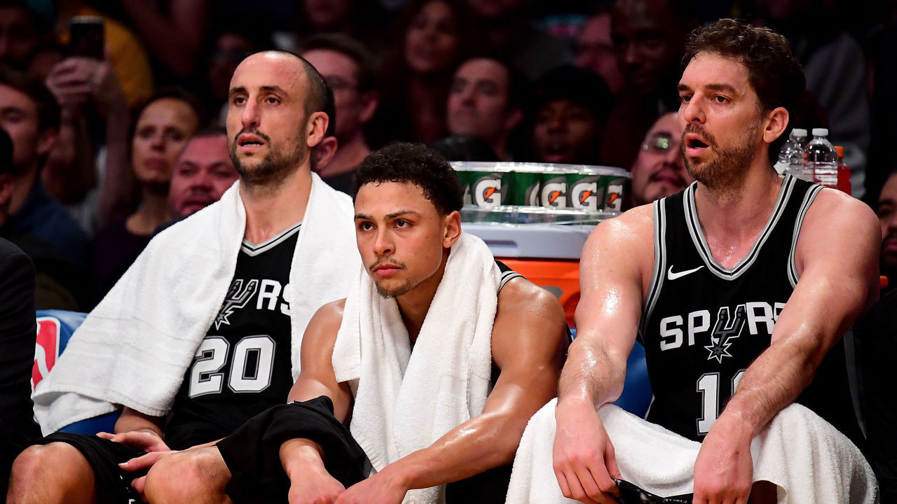 LOS ANGELES, CA - JANUARY 11: (L-R) Manu Ginobili #20, Bryn Forbes #11 and Pau Gasol #16 of the San Antonio Spurs watch during a 93-81 Los Angeles Laker win at Staples Center on January 11, 2018 in Los Angeles, California.