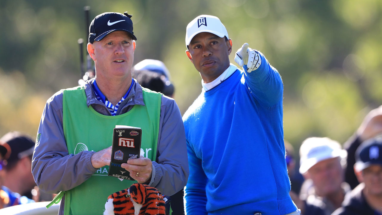 PALM HARBOR, FL - MARCH 09: Tiger Woods talks with his caddie before playing his shot from the 14th tee during the second round of the Valspar Championship at Innisbrook Resort Copperhead Course on March 9, 2018 in Palm Harbor, Florida.