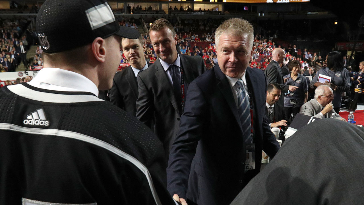 CHICAGO, IL - JUNE 24: Jaret Anderson-Dolan, 41st overall pick of the Los Angeles Kings, shakes the hand of assistant general manager Mike Futa of the Los Angeles Kings during the 2017 NHL Draft at United Center on June 24, 2017 in Chicago, Illinois.