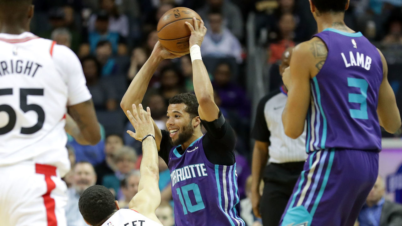 CHARLOTTE, NC - FEBRUARY 11: Michael Carter-Williams #10 of the Charlotte Hornets tries to keep the ball from Fred VanVleet #23 of the Toronto Raptors during their game at Spectrum Center on February 11, 2018 in Charlotte, North Carolina.