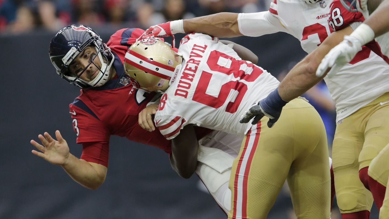 HOUSTON, TX - DECEMBER 10: Tom Savage #3 of the Houston Texans is hit by Elvis Dumervil #58 of the San Francisco 49ers in the second quarter at NRG Stadium on December 10, 2017 in Houston, Texas.