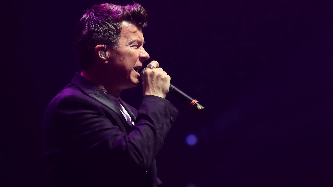 British singer songwriter Rick Astley performs during the 'We Are Manchester' charity concert at the Manchester Arena in Manchester, northwest England, on September 9, 2017 held to honour those affected by the May 22 Manchester Arena bombing. Thousands of music fans cheered the names of those killed in the May 22 Manchester Arena terror attack as the venue re-opened for the first time with a charity concert. The event was held to honour those affected by the bomding and to raise money for a permanent memorial for the 22 victims killed when suicide bomber Salman Abedi detonated a device in the arena foyer at the end of an Ariana Grande concert on May 22. / AFP PHOTO / POOL / Peter Byrne / RESTRICTED TO EDITORIAL USE -NO MARKETING NO ADVERTISING CAMPAIGNS NO COMMERCIAL USE