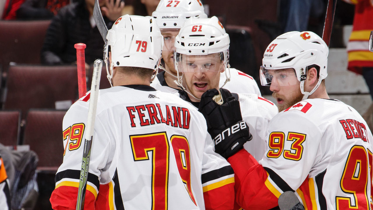 OTTAWA, ON - MARCH 9: Sam Bennett #93 of the Calgary Flames celebrates his first period goal against the Ottawa Senators with teammates Micheal Ferland #79, Brett Kulak #61 and Dougie Hamilton #27 at Canadian Tire Centre on March 9, 2018 in Ottawa, Ontario, Canada.