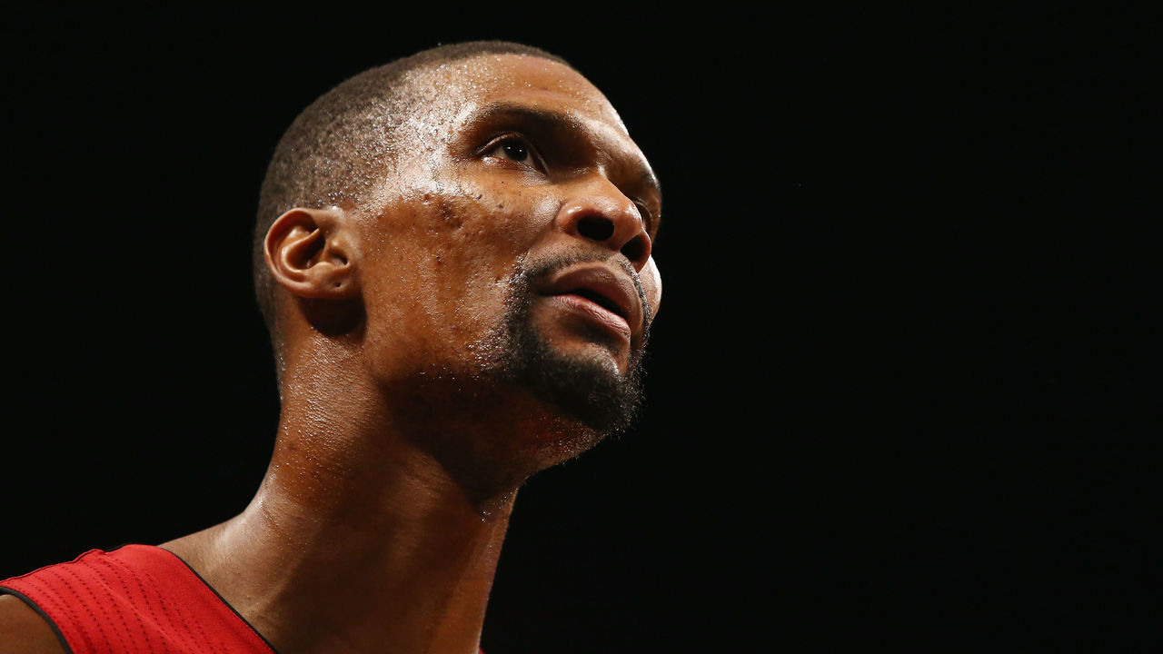 NEW YORK, NY - JANUARY 26: Chris Bosh #1 of the Miami Heat looks on against the Brooklyn Nets during their game at the Barclays Center on January 26, 2016 in New York City. NOTE TO USER: User expressly acknowledges and agrees that, by downloading and/or using this Photograph, user is consenting to the terms and conditions of the Getty Images License Agreement.