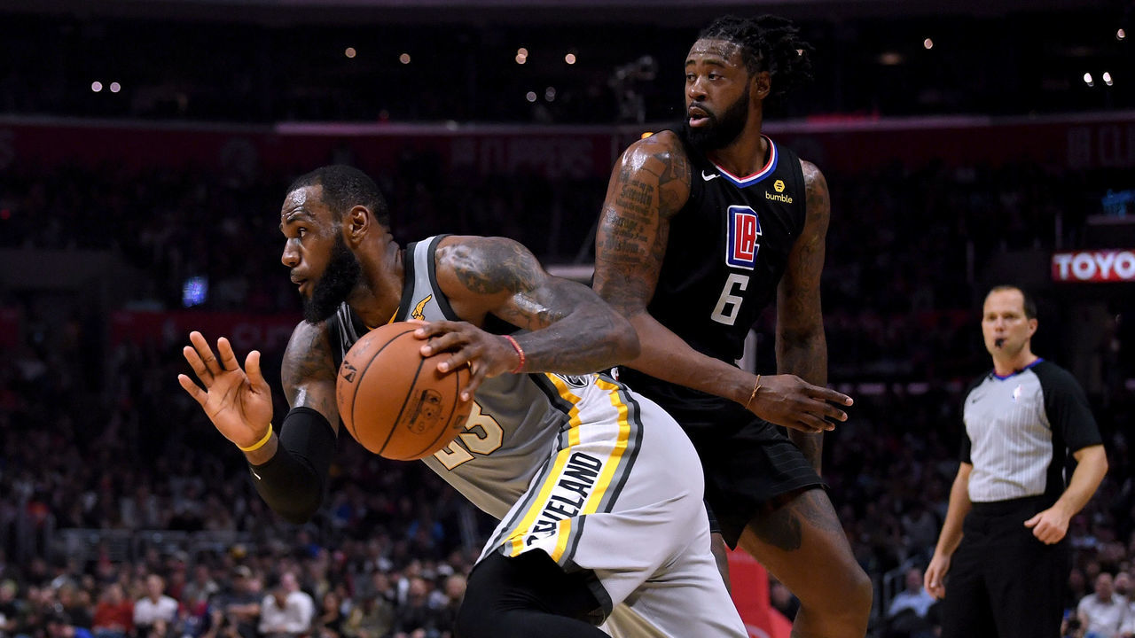 LOS ANGELES, CA - MARCH 09: LeBron James #23 of the Cleveland Cavaliers dribbles by DeAndre Jordan #6 of the LA Clippers during a 116-102 Clipper win at Staples Center on March 9, 2018 in Los Angeles, California.