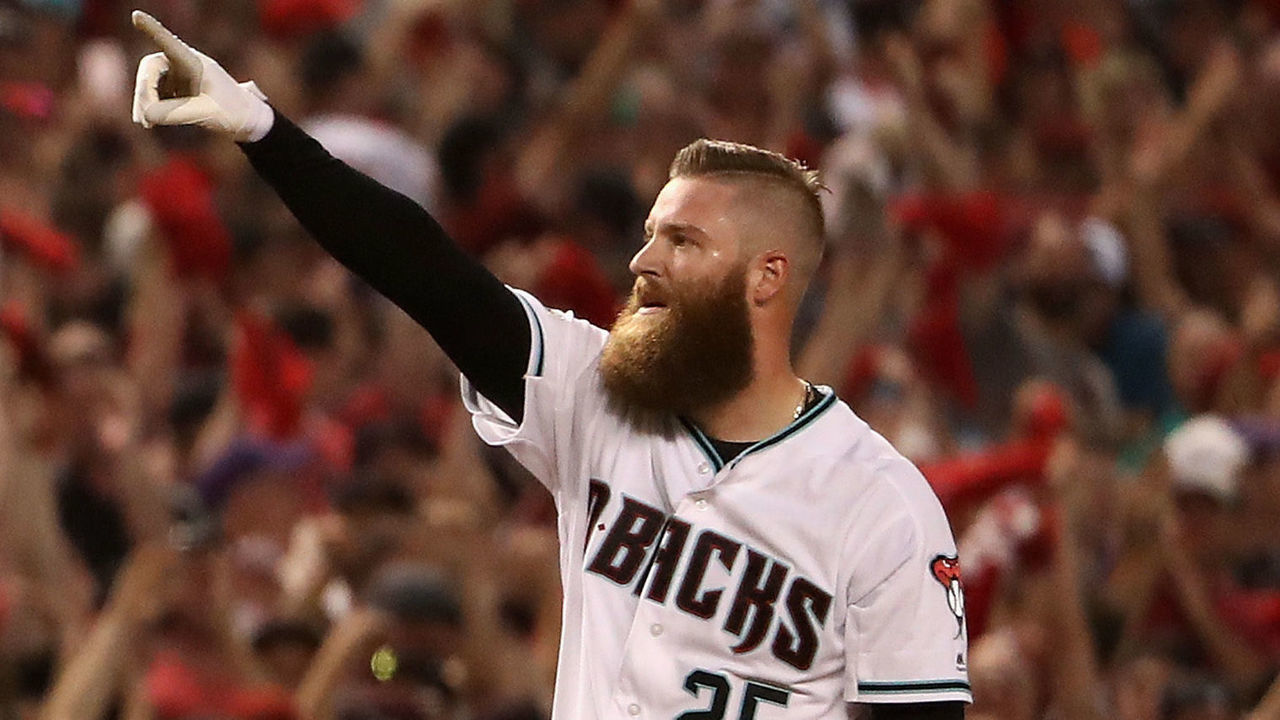 PHOENIX, AZ - OCTOBER 04: Archie Bradley #25 of the Arizona Diamondbacks reacts after hitting aN RBI triple during the bottom of the seventh inning of the National League Wild Card game against the Colorado Rockies at Chase Field on October 4, 2017 in Phoenix, Arizona.