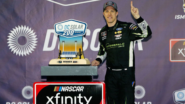 AVONDALE, AZ - MARCH 10: Brad Keselowski, driver of the #22 Fitzgerald Glider Kits Ford, poses in Victory Lane after winning the NASCAR Xfinity Series DC Solar 200 at ISM Raceway on March 10, 2018 in Avondale, Arizona.