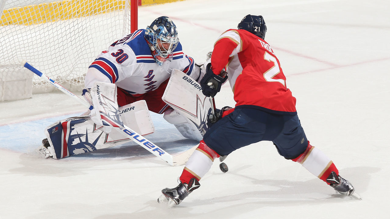 SUNRISE, FL - MARCH 10: Vincent Trocheck #21 of the Florida Panthers skates in on goaltender Henrik Lundqvist #30 of the New York Rangers to score the game winning goal in the shootout at the BB&T Center on March 10, 2018 in Sunrise, Florida. The Panthers defeated the Rangers 4-3 in a shootout.