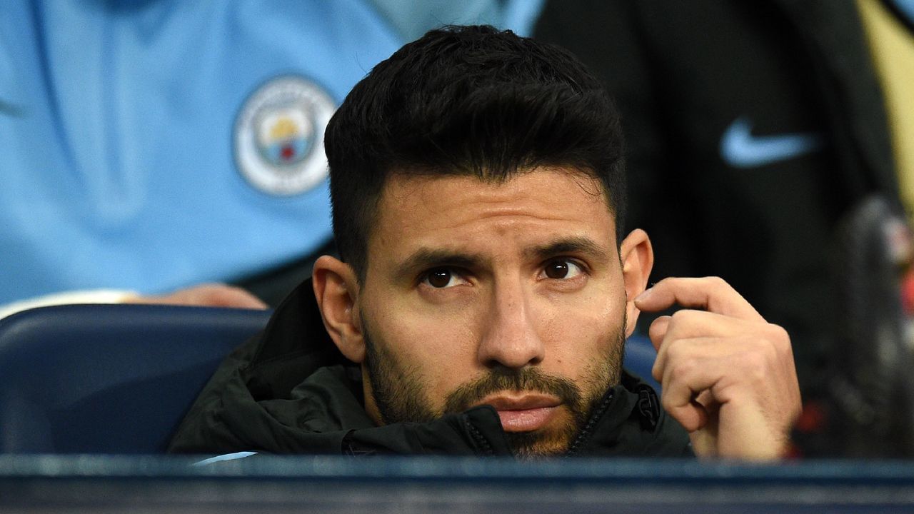Manchester City's Argentinian striker Sergio Aguero takes his seat on the bench ahead of the UEFA Champions League round of sixteen second leg football match between Manchester City and Basel at the Etihad Stadium in Manchester, north west England, on March 7, 2018. / AFP PHOTO / Oli SCARFF