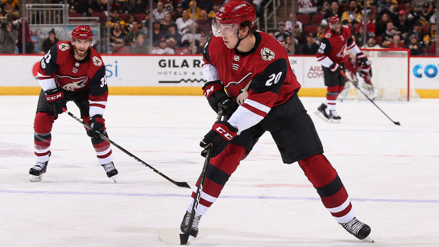 GLENDALE, AZ - DECEMBER 16: Dylan Strome #20 of the Arizona Coyotes skates with the puck ahead of Alex Goligoski #33 during the third period of the NHL game against the Pittsburgh Penguins at Gila River Arena on December 16, 2017 in Glendale, Arizona. The Penguins defeated the Coyotes 4-2.