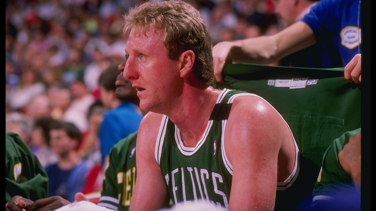 Forward Larry Bird of the Boston Celtics sits on the bench during a game.