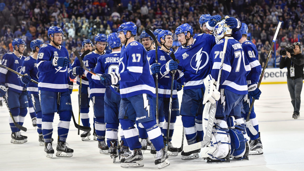 TAMPA, FL - MARCH 10: The Lightning congratulate Tampa Bay Lightning goalie Louis Domingue (70) for a shootout victory during an NHL game between the Montreal Canadiens and the Tampa Bay Lightning on March 10, 2018, at Amalie Arena in Tampa, FL.