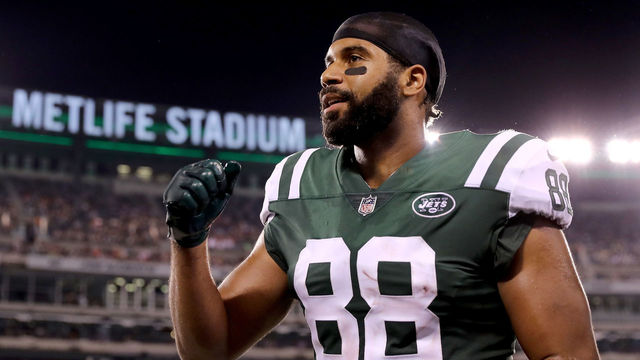 EAST RUTHERFORD, NJ - AUGUST 12: Austin Seferian-Jenkins #88 of the New York Jets celebrates from the sideline in the second quarter against the Tennessee Titans during a preseason game at MetLife Stadium on August 12, 2017 in East Rutherford, New Jersey.