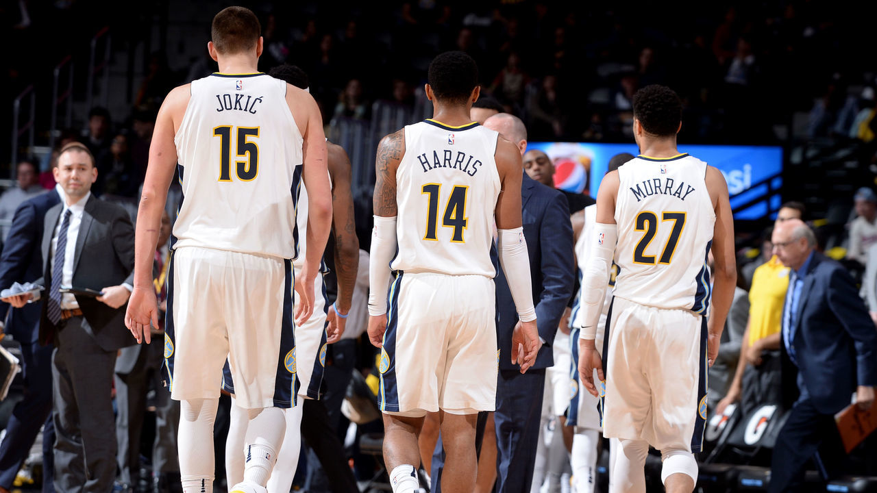DENVER, CO - FEBRUARY 5: Nikola Jokic #15 Gary Harris #14 and Jamal Murray #27 of the Denver Nuggets walk to the sideline during a time out during the game against the Charlotte Hornets on February 5, 2018 at the Pepsi Center in Denver, Colorado. NOTE TO USER: User expressly acknowledges and agrees that, by downloading and/or using this Photograph, user is consenting to the terms and conditions of the Getty Images License Agreement. Mandatory Copyright Notice: Copyright 2018 NBAE
