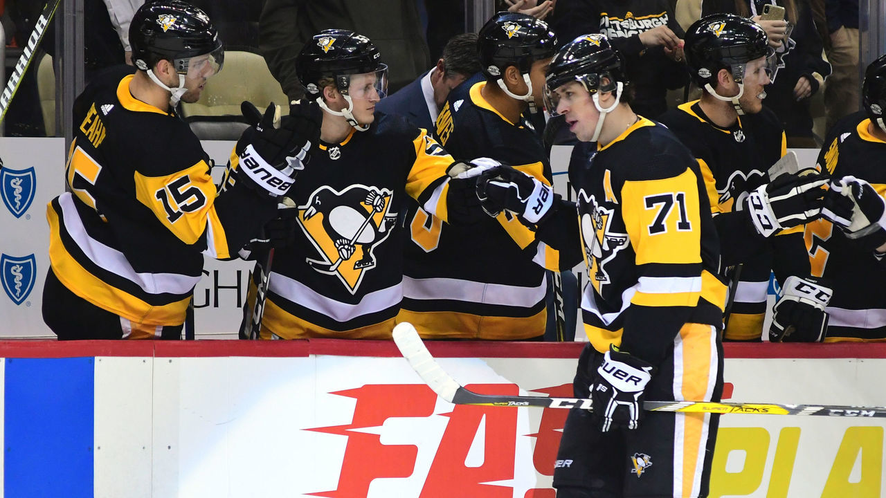 PITTSBURGH, PA - FEBRUARY 17: Evgeni Malkin #71 of the Pittsburgh Penguins is congratulated by his bench after scoring a goal against the Toronto Maple Leafs at PPG PAINTS Arena on February 17, 2018 in Pittsburgh, Pennsylvania.