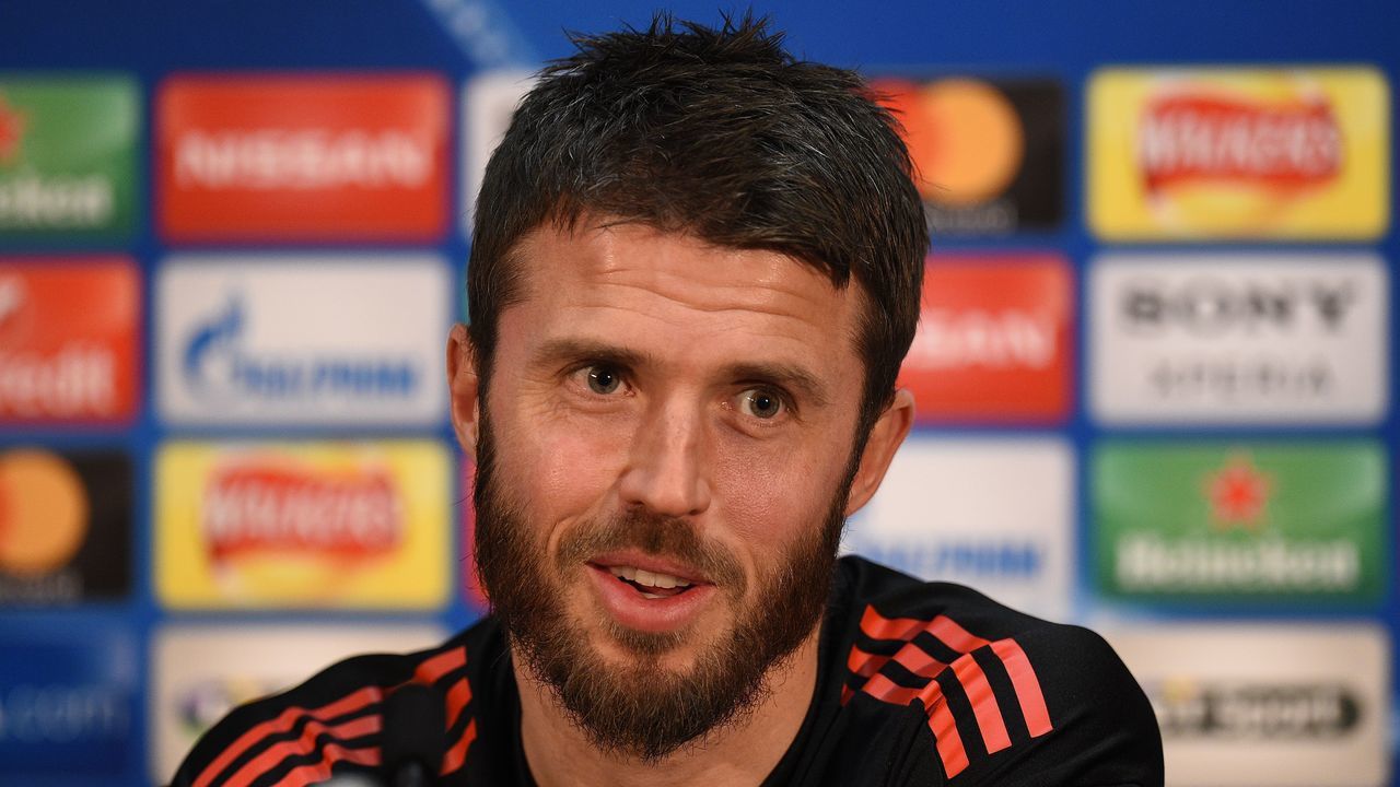 Manchester United's English midfielder Michael Carrick attends a press conference following a team training session, at Old Trafford stadium in Manchester, north west England on March 12, 2018, on the eve of their UEFA Champions League round of 16 second-leg football match against Sevilla. / AFP PHOTO / Oli SCARFF