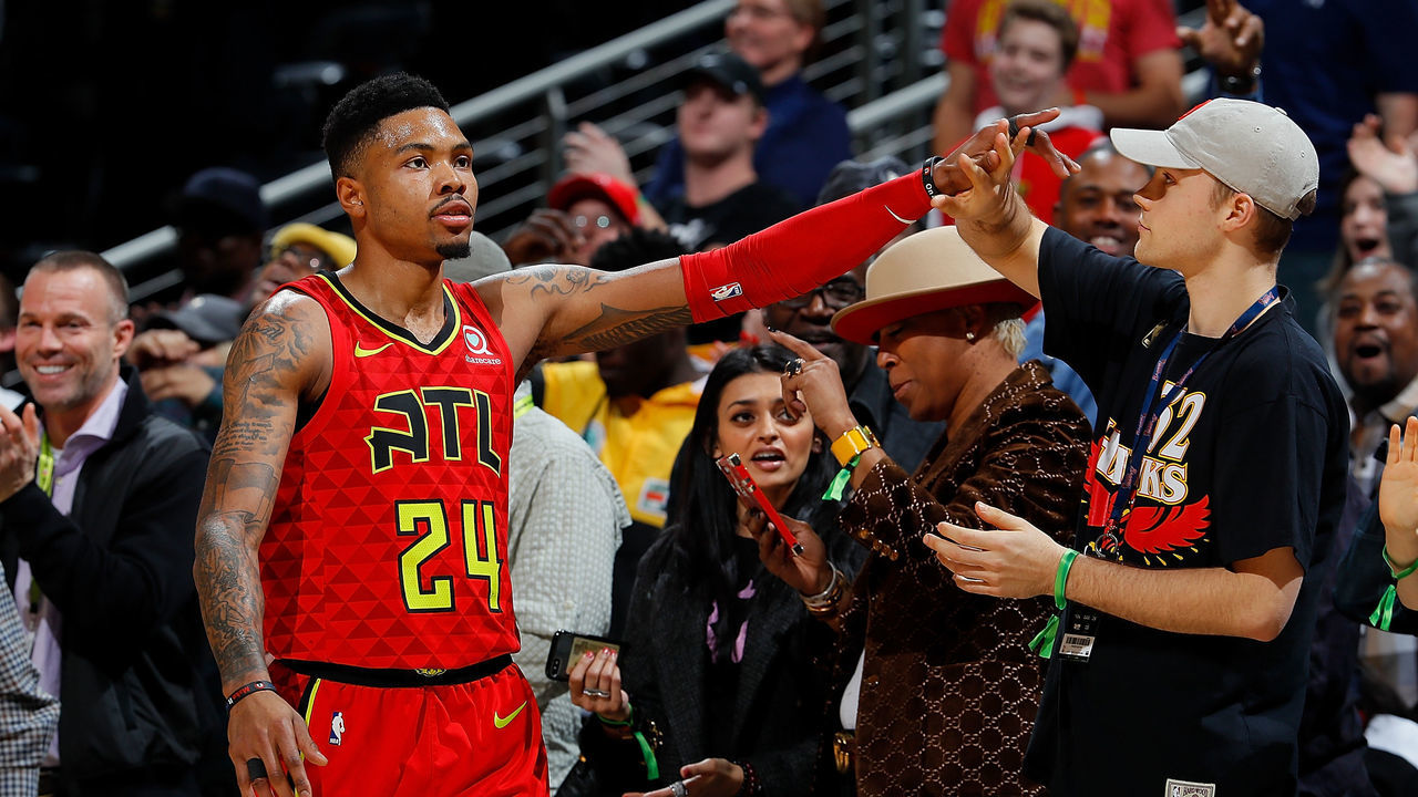 ATLANTA, GA - JANUARY 29: Kent Bazemore #24 of the Atlanta Hawks celebrates with fans in the final seconds of their 105-100 win over the Minnesota Timberwolves at Philips Arena on January 29, 2018 in Atlanta, Georgia.