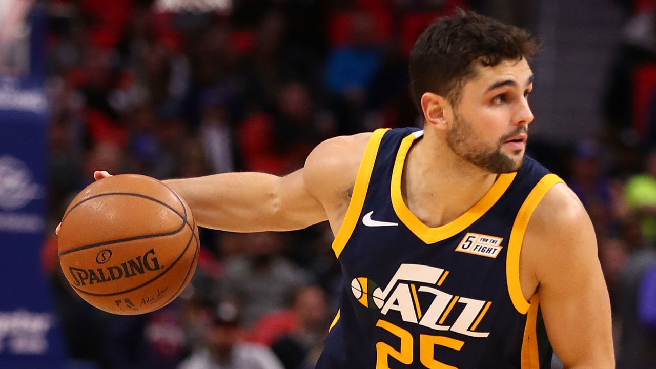 DETROIT, MI - JANUARY 24: Raul Neto #25 of the Utah Jazz brings the ball up court while playing the Detroit Pistons at Little Caesars Arena on January 24, 2018 in Detroit, Michigan.