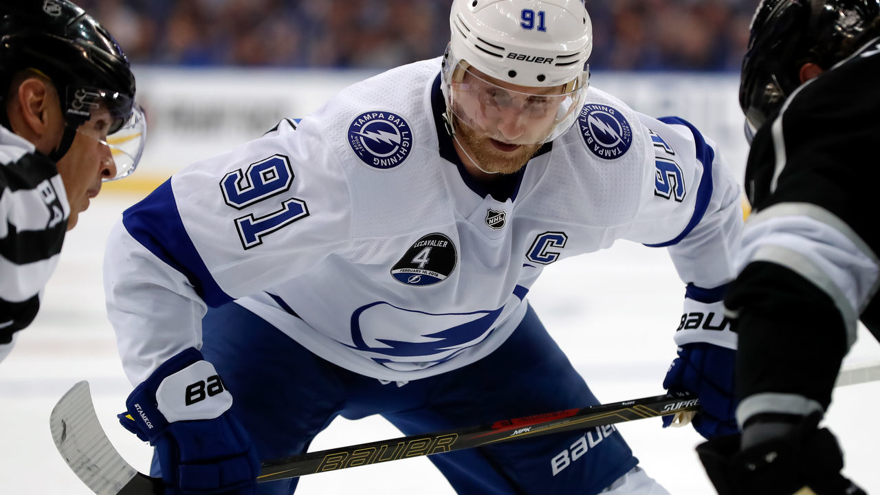 TAMPA, FL - FEBRUARY 10: Steven Stamkos #91 of the Tampa Bay Lightning readies for a face-off against the Los Angeles Kings with a jersey featuring a patch recognizing the #4 jersey of Vincent Lecavalier retired before the game at the Amalie Arena on February 10, 2018 in Tampa, Florida.