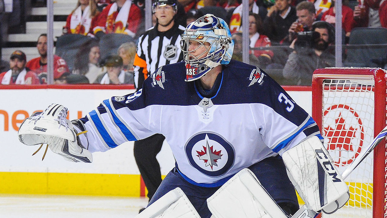 CALGARY, AB - OCTOBER 7: Steve Mason #35 of the Winnipeg Jets in action against the Calgary Flames during an NHL game at Scotiabank Saddledome on October 7, 2017 in Calgary, Alberta, Canada.