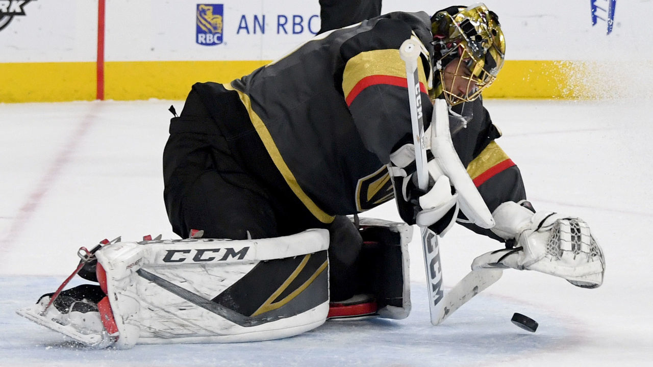 LAS VEGAS, NV - JANUARY 23: Marc-Andre Fleury #29 of the Vegas Golden Knights covers the puck to stop a shot by the Columbus Blue Jackets in the first period of their game at T-Mobile Arena on January 23, 2018 in Las Vegas, Nevada.