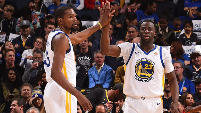 OAKLAND, CA - MARCH 6: Draymond Green #23 high fives Kevin Durant #35 of the Golden State Warriors during the game against the Brooklyn Nets on March 6, 2018 at ORACLE Arena in Oakland, California. NOTE TO USER: User expressly acknowledges and agrees that, by downloading and or using this photograph, user is consenting to the terms and conditions of Getty Images License Agreement. Mandatory Copyright Notice: Copyright 2018 NBAE