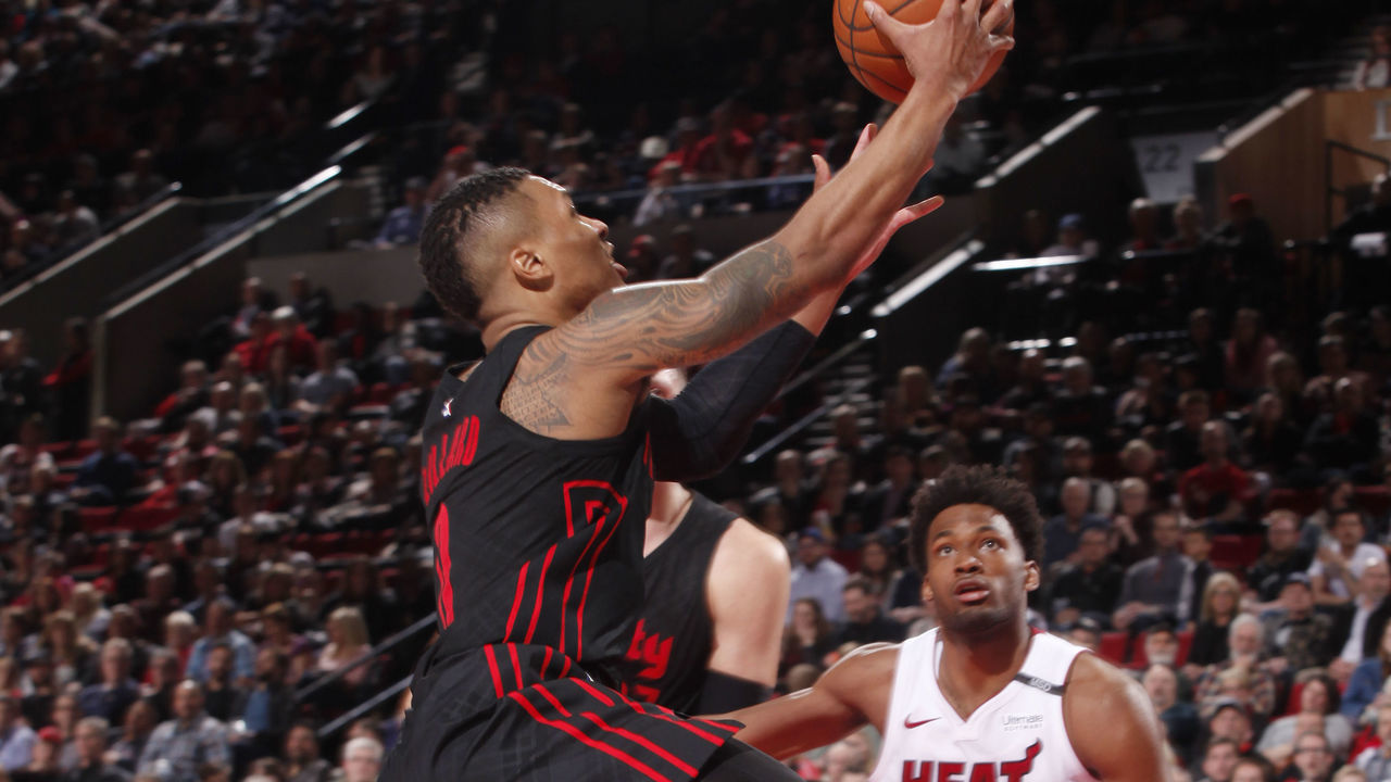 PORTLAND, OR - MARCH 12: Damian Lillard #0 of the Portland Trail Blazers goes to the basket against the Miami Heat on March 12, 2018 at the Moda Center in Portland, Oregon. Mandatory Copyright Notice: Copyright 2018 NBAE